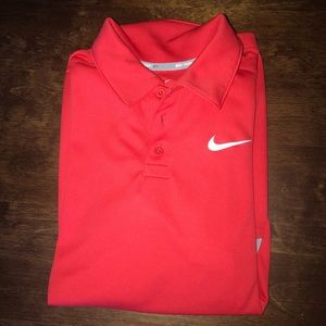 Women’s size large Nike polo.